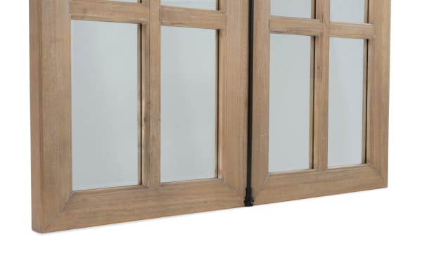 Wooden framed window with clear glass panes and a black metal latch, showcasing natural wood grain texture and rustic style.