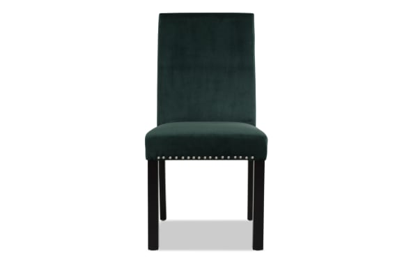 Dark green velvet upholstered dining chair with high backrest, silver nailhead trim, and dark wooden legs, modern style.