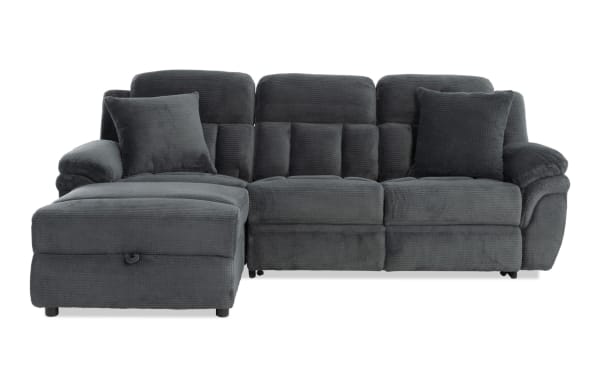 Dark gray fabric sectional sofa with plush cushions, padded armrests, and a left chaise lounge, designed for modern living rooms.