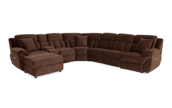Brown sectional sofa with plush corduroy fabric, reclining seats, cup holders, and cushioned armrests, designed for spacious living rooms.