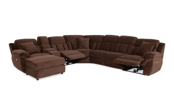 Sectional recliner sofa in dark brown corduroy fabric with plush cushions, two reclining seats, cup holders, and corner design for spacious living room seating.