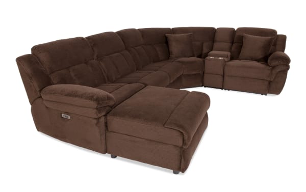 Brown sectional recliner sofa with plush fabric upholstery, cushioned armrests, cup holders, and adjustable seating for living room comfort.