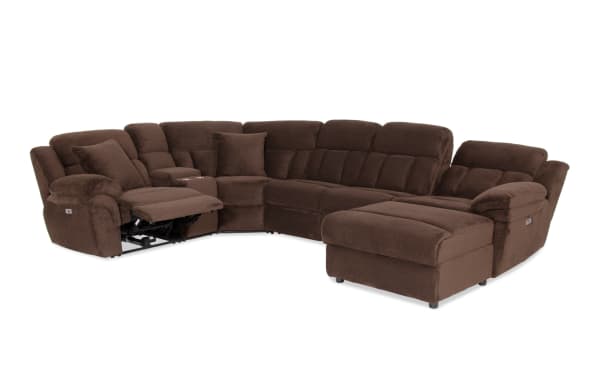 Brown sectional reclining sofa with corduroy fabric upholstery, plush cushioning, cup holders, and adjustable footrest for living room comfort.