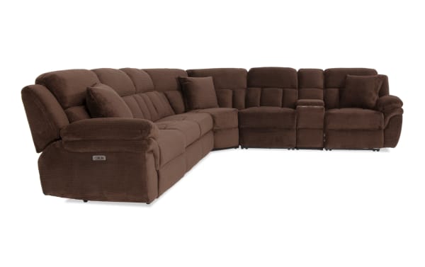 Large brown sectional sofa with plush corduroy fabric, reclining seats, cushioned armrests, and a center console for storage and cup holders.