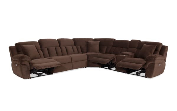 Brown sectional reclining sofa with plush corduroy fabric, cushioned armrests, and built-in cup holders, designed for living room comfort.