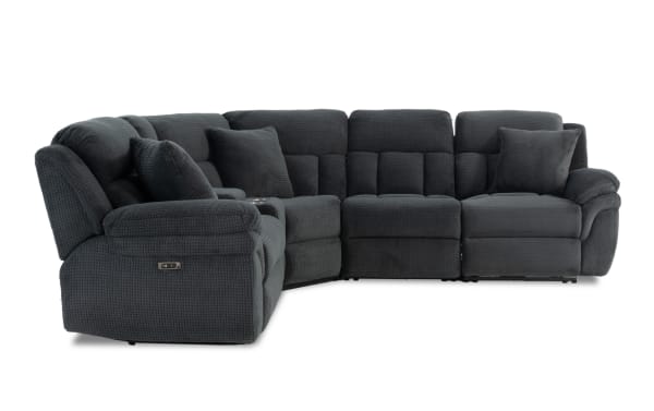 Dark gray fabric sectional sofa with plush cushioning, reclining seats, and two matching throw pillows, designed for living room comfort.