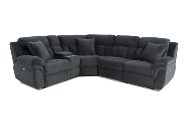 Dark gray sectional reclining sofa with plush cushions, textured fabric upholstery, cup holders, and multiple throw pillows, ideal for living room comfort.