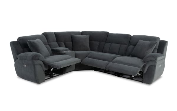Dark gray fabric sectional sofa with plush cushioning, reclining seats, cup holders, and matching pillows, designed for living room comfort.