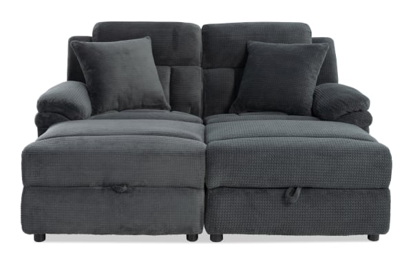 Dark gray fabric sectional sofa with plush cushions, textured upholstery, and padded armrests, designed for modern living room comfort.