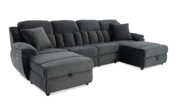Dark gray fabric sectional sofa with plush cushions, reclining chaise lounge, and matching throw pillows, designed for modern living rooms.