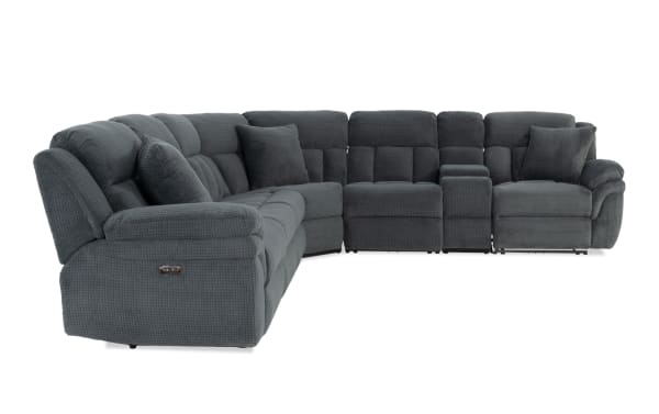Gray fabric sectional sofa with plush cushioning, reclining seats, and matching throw pillows, designed for living room comfort and style.