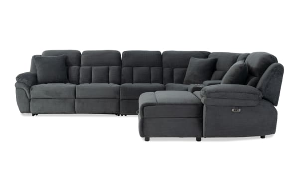 Dark gray fabric sectional sofa with plush cushions, reclining seats, and a chaise lounge, designed for modern living rooms.