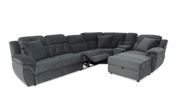 Dark gray fabric sectional sofa with reclining seats, plush cushions, and a chaise lounge, designed for comfort and modern living rooms.