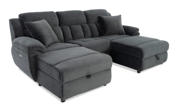 Dark gray fabric sectional sofa with plush cushions, chaise lounge on both ends, and soft textured upholstery for living room comfort.