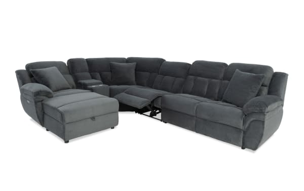 Dark gray fabric sectional sofa with plush cushions, reclining seats, chaise lounge, and built-in cup holders, designed for living room comfort.