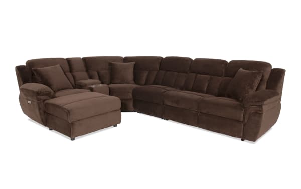 Brown sectional reclining sofa with plush cushions, corduroy fabric upholstery, cup holders, and chaise lounge for living room comfort.