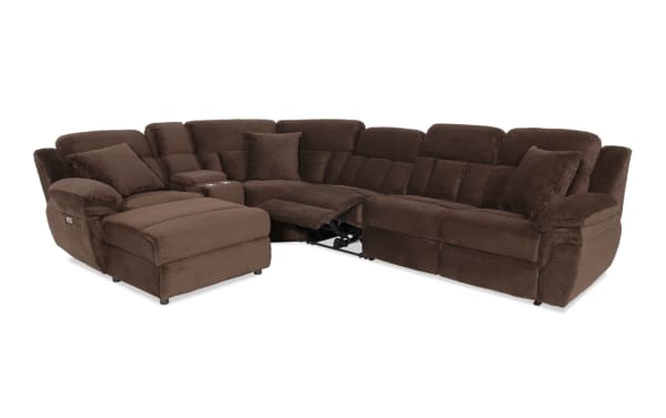 Brown sectional reclining sofa with plush cushions, soft fabric upholstery, built-in cup holders, and chaise lounge for living room comfort.
