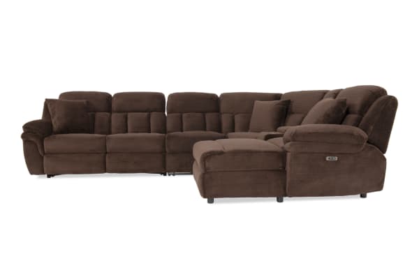 Brown sectional reclining sofa with plush cushions, soft fabric upholstery, and multiple pillows, designed for comfort and relaxation.