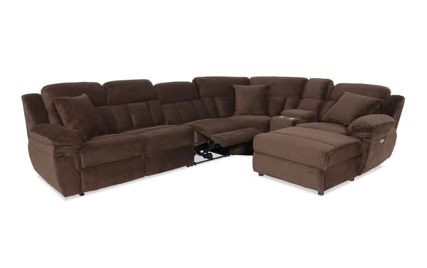 Brown fabric sectional sofa with reclining seats, plush cushions, and a chaise lounge, designed for comfort and relaxation.