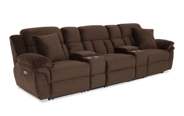 Brown fabric reclining sectional sofa with cup holders, plush cushioning, and two matching throw pillows, designed for living room comfort.