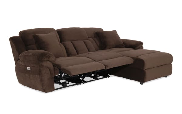 Brown fabric reclining sectional sofa with plush cushions, padded armrests, and two reclining seats for enhanced comfort and relaxation.