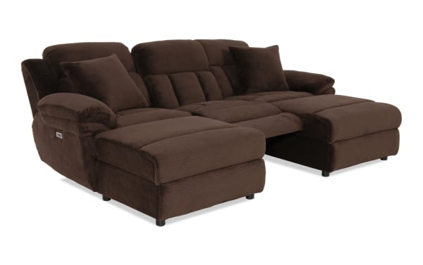 Dark brown plush fabric sectional sofa with reclining seats, padded armrests, and matching cushions, designed for living room comfort and style.
