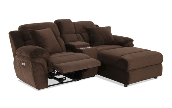 Brown fabric sectional sofa with plush cushions, reclining seat, built-in cup holders, and padded armrests for living room comfort.