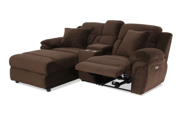 Brown sectional sofa with plush corduroy fabric, reclining seat, chaise lounge, cup holders, and cushioned armrests for living room comfort.