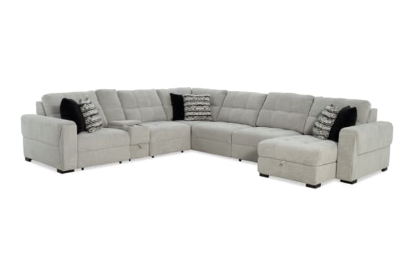Slider Bob Gray 150'' Power Sliding 7 Piece Chaise Sectional in gray polyester fabric, transitional style with memory foam cushions, USB & USB-C ports, six accent pillows, cup holders, and storage compartments for comfort and convenience.
