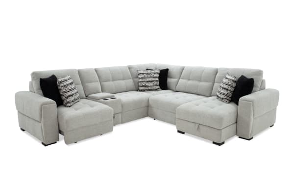 Slider Bob Gray 131'' power sliding 6-piece right arm facing chaise sectional in gray polyester fabric. Transitional style with tufted cushions, built-in cup holders, USB and USB-C ports, cozy accent pillows, and hidden storage for comfort and convenience.