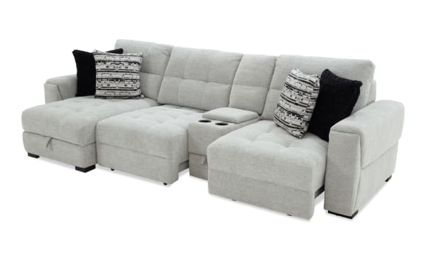Slider Bob Gray 129'' power sliding 4-piece left arm facing chaise sectional in gray polyester fabric. Transitional style with power recline, memory foam cushions, USB and USB-C ports, cup holders, built-in storage, and cozy accent pillows.