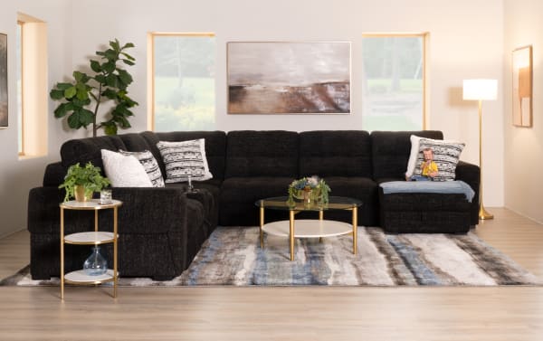 Slider Bob Black 131'' power sliding 6-piece sectional in black polyester fabric with USB/USB-C ports, cup holders, storage, and memory foam cushions.