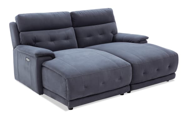 Rumor Blue 84'' power reclining dual chaise sofa in blue polyester fabric, featuring power headrests, contemporary cushion arms, and plush memory foam upholstery.