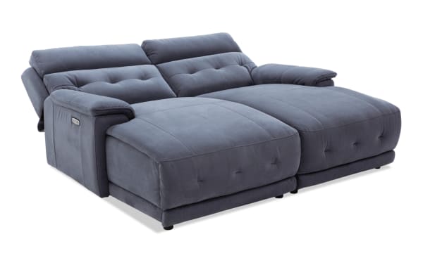 Rumor Blue 84'' power reclining dual chaise sofa in blue polyester fabric with power headrests, contemporary cushion arms, and plush memory foam upholstery.