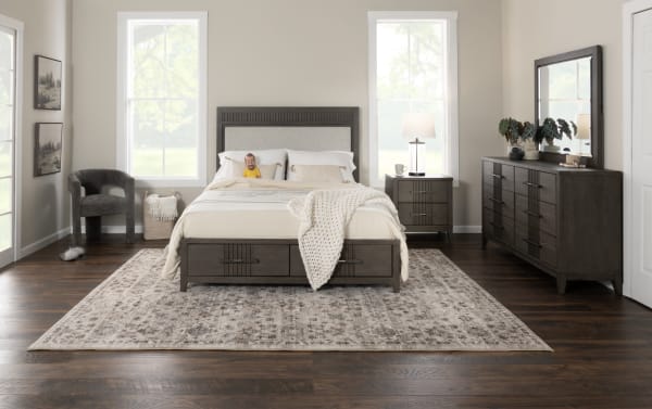 Transitional Laguna 4 Piece Queen Bedroom Set in dark brown and gray pine solids with gray polyester fabric, featuring storage platform bed, nightstand, dresser, and mirror.