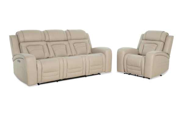 Beige leather reclining sofa and armchair set with padded cushions and stitched detailing, designed for living room comfort and style.