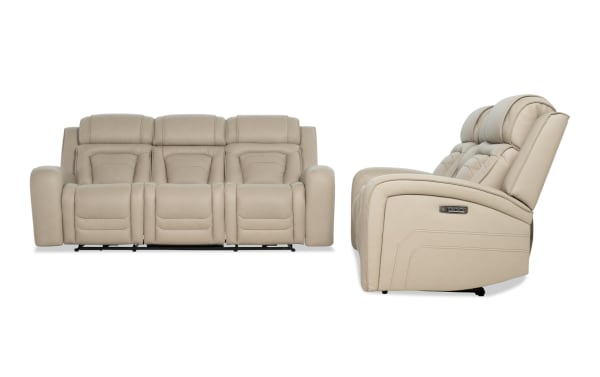 Beige leather reclining three-seat sofa with padded headrests and armrests, featuring electric control buttons on the side for adjustable comfort.
