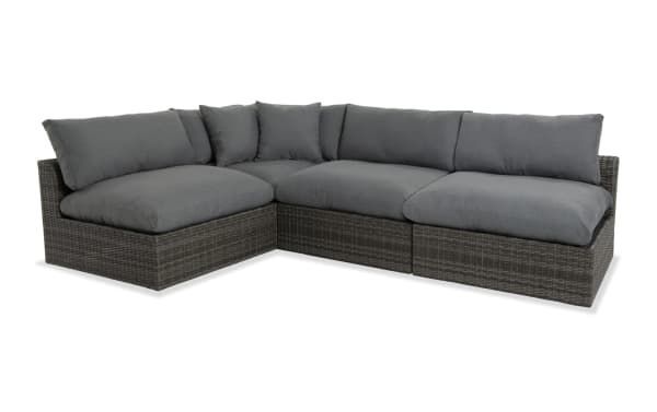 Dream 4 Piece Gray Wicker Outdoor Sectional with oversized reversible cushions, all-weather wicker, aluminum frame, and polyester fabric in transitional style.