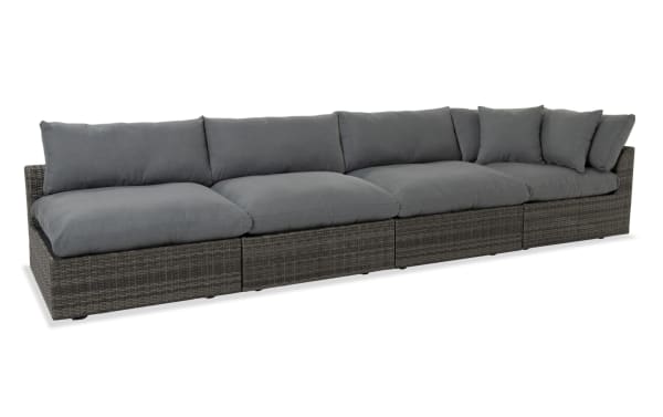 Dream 4 Piece Gray Wicker Outdoor Sectional with oversized reversible cushions, all-weather wicker, aluminum frame, and gray polyester fabric upholstery.