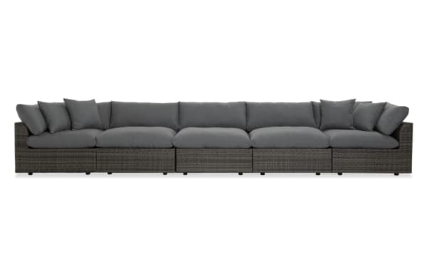 Gray Dream 5 Piece Wicker Outdoor Sectional with oversized reversible cushions, modular design, aluminum frame, and polyester fabric upholstery.