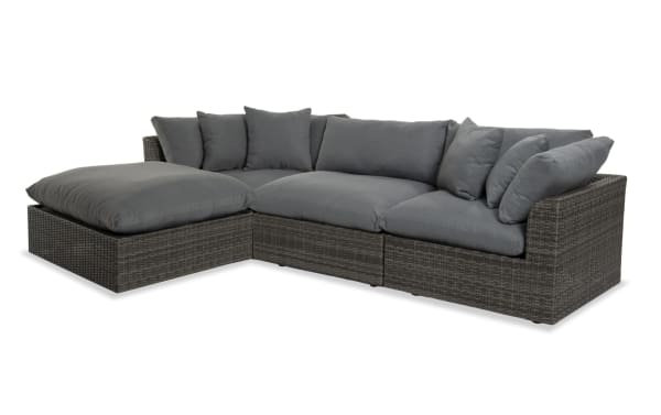 Dream 4 Piece Gray Wicker Outdoor Sectional with oversized reversible cushions, all-weather wicker, aluminum frame, and gray polyester fabric pillows.