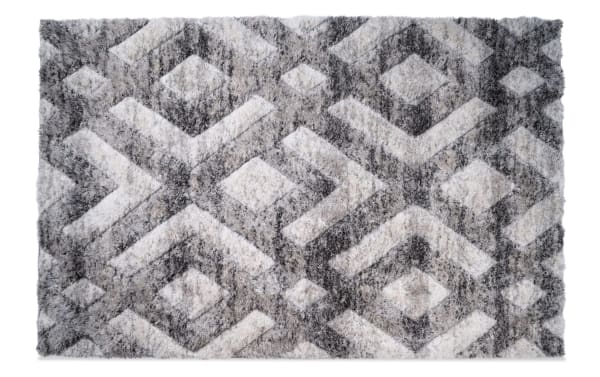 Rectangular gray and white shag area rug with a geometric diamond pattern, featuring soft, plush texture suitable for living room or bedroom flooring.
