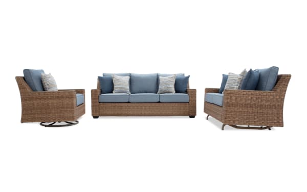 Outdoor patio furniture set with woven rattan frame, blue cushions, and striped accent pillows, including a sofa, loveseat, and swivel chair.