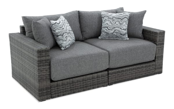 Modular Bob® 2 Piece Gray Wicker Outdoor Loveseat with rust-proof aluminum frame, all-weather gray wicker, and plush polyester cushions in transitional style.