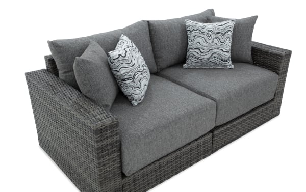 Modular Bob® 2 Piece Gray Wicker Outdoor Loveseat with transitional style, gray all-weather wicker frame, rust-proof aluminum, and plush polyester cushions.