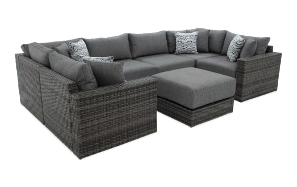 Modular Bob® 7 Piece Gray Wicker Outdoor Conversation Set with Ottoman in transitional style, featuring gray all-weather wicker, rust-proof aluminum frame, and plush polyester cushions with memory foam.