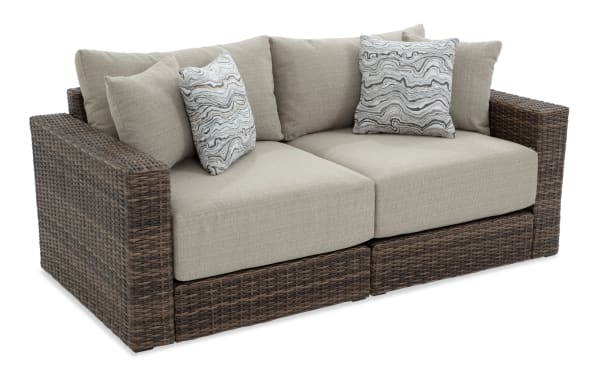 Modular Bob® 2 Piece Beige & Brown Wicker Outdoor Loveseat with all-weather wicker, rust-proof aluminum frame, and beige polyester cushions in transitional style.