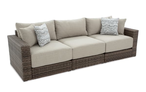 Modular Bob® 3 Piece Beige & Brown Wicker Outdoor Conversation Set with rust-proof aluminum frame, all-weather wicker, and beige polyester cushions in transitional style.