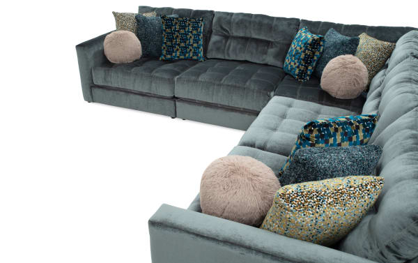 Emerald green Jewels 131'' 5-piece modular sectional sofa with plush polyester fabric, Bob-O-Pedic gel memory foam, and assorted glam accent pillows.