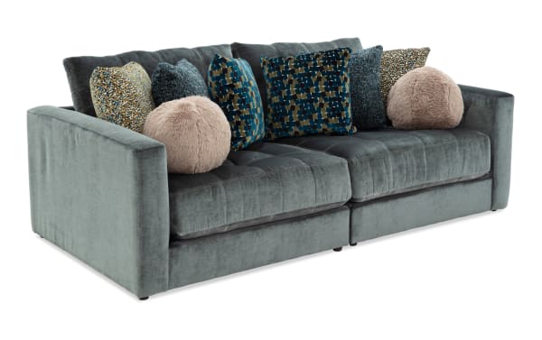 Emerald green Jewels 92'' 2-piece modular loveseat with plush polyester fabric, glam style, gel memory foam cushions, and assorted patterned accent pillows.